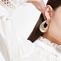 Gold colour textured doorknocker earrings